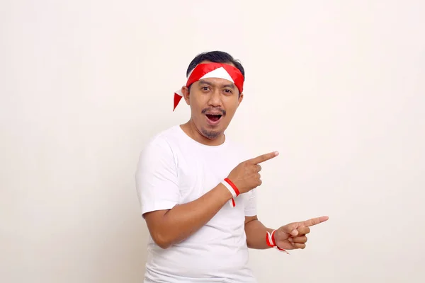 Excited Asian Man Pointing Something Him Indonesian Independence Day Concept — Foto de Stock