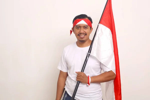 Happy Asian Adult Man Standing While Holding Indonesian Flag Independence — Φωτογραφία Αρχείου