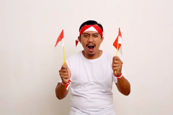 Passionate Asian Man Standing While Holding Small Indonesian Flag Independence — ストック写真
