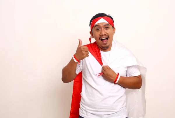 Asian Man Standing While Holding Indonesian Flag Showing Thumbs Independence — 图库照片