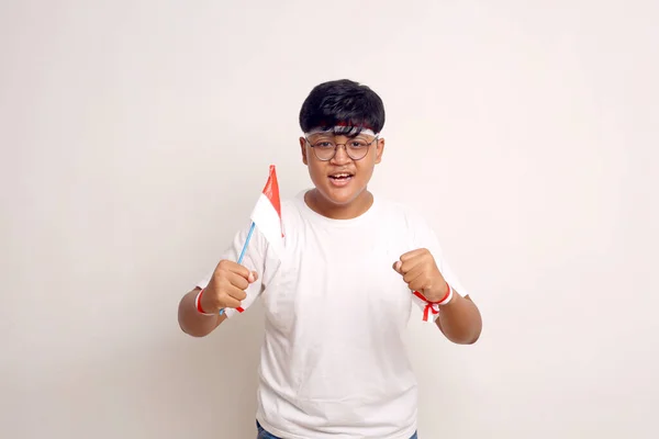 Asian Boy Holding Indonesian Flag While Clenching His Hand Independence — Foto Stock