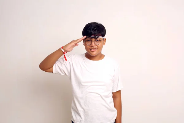 Asian Boy Standing While Showing Salute Gesture Indonesian Independence Day — Stockfoto