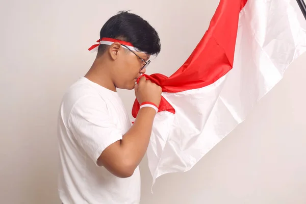 Asian Boy Kissing Indonesian Flag Independence Day Concept Isolated White — Stockfoto