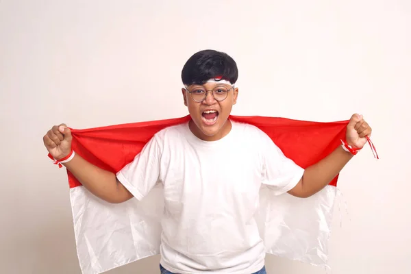 Passionate Asian Boy Holding Indonesian Flag Screaming Indonesian Independence Day — Foto de Stock