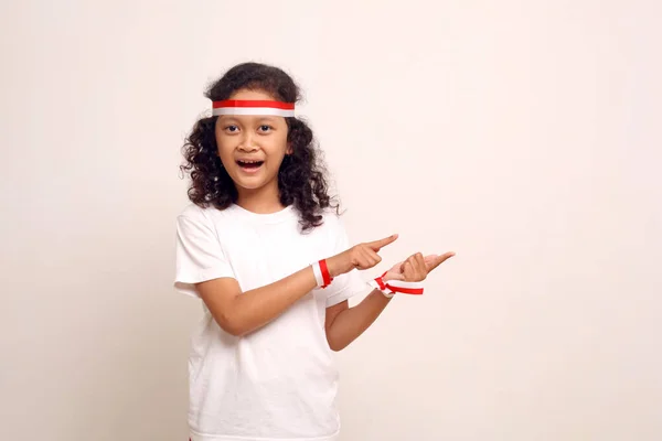 Happy Asian Girl Standing While Pointing Sideways Indonesian Independence Day — Stockfoto