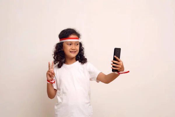 Asian Little Girl Doing Selfie Her Cell Phone Indonesian Independence — стоковое фото