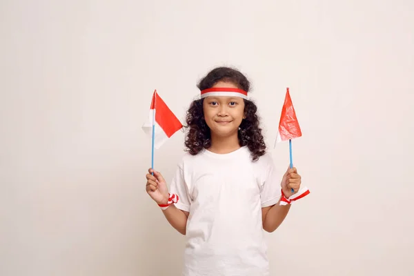 Adorable Asian Girl Standing While Holding Indonesian Flag Isolated White — Stok Foto