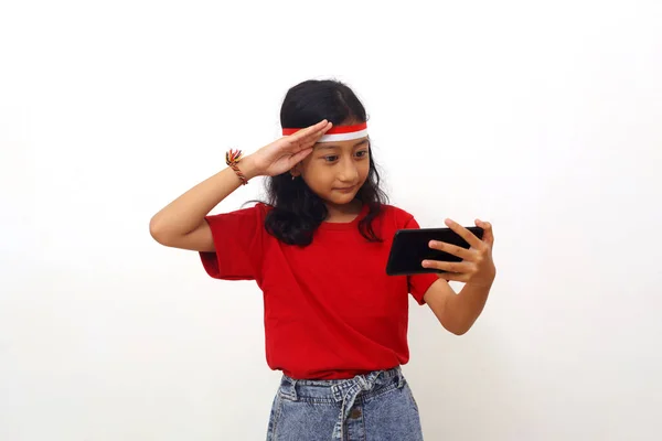 Adorable Asian Girl Standing While Online Indonesian Independence Day Ceremony — 图库照片