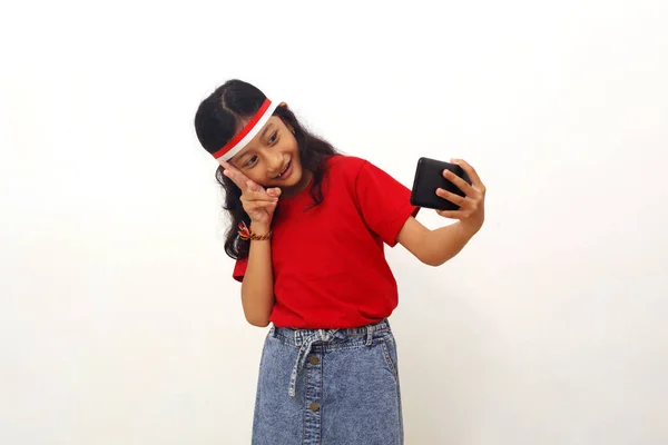 Happy Asian Little Girl Standing While Doing Selfie Her Cell — Stok fotoğraf