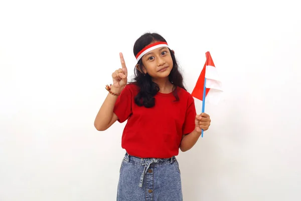 Asian Girl Standing Holding Indonesian Flag While Showing One Finger — стоковое фото