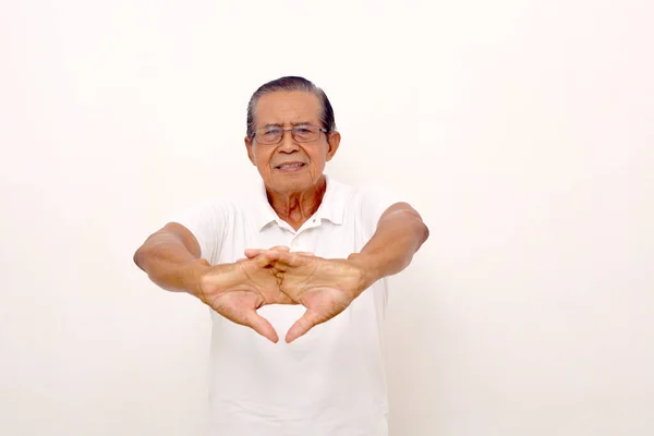 Asian Old Man Standing While Stretching His Hand Isolated White — Φωτογραφία Αρχείου