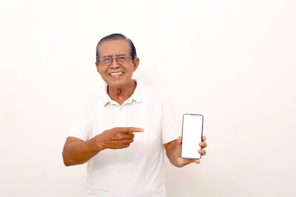 Elderly Asian Man Standing While Pointing Blank Cell Phone Screen — Foto Stock