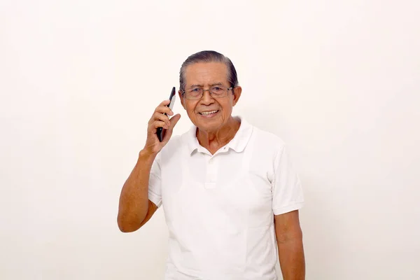Happy Elderly Asian Man Standing While Talking Phone Isolated White — ストック写真
