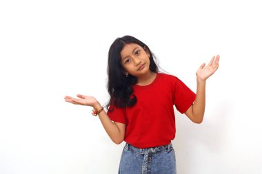 Asian little girl standing with confused gesture. Isolated on white background