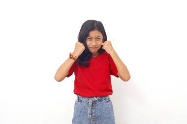 Angry little asian kid showing frustration and disagreement. Isolated on white background