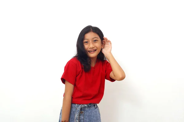 Asian Little Girl Standing Hand Her Ear Listening Something Isolated — Fotografia de Stock