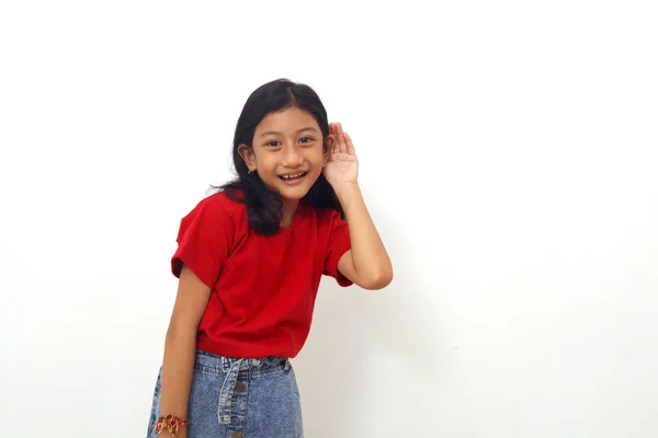 Asian Little Girl Standing Hand Her Ear Listening Something Isolated — Stock Photo, Image