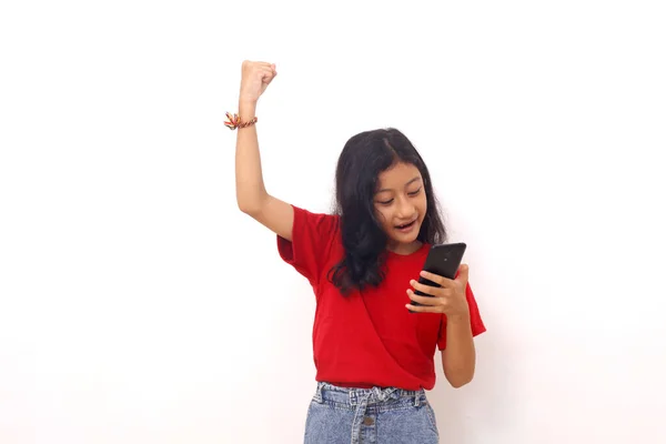 Happy Asian Little Girl Standing While Holding Cell Phone Clenching — Fotografia de Stock