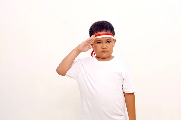 Asian Boy Standing Respect Salute Gesture Indonesian Independence Day Concept — Zdjęcie stockowe