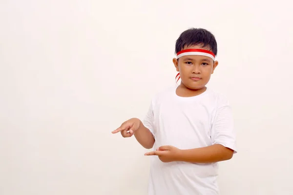 Asian Boy Standing While Pointing Sideways Indonesian Independence Day Concept — Stock Fotó