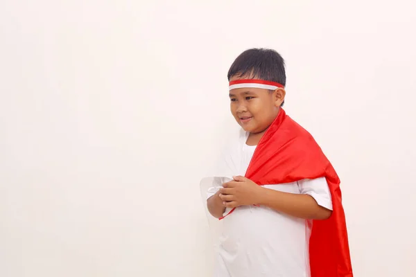 Happy Asian Boy Standing While Carrying Indonesian Flag Independence Day — Zdjęcie stockowe