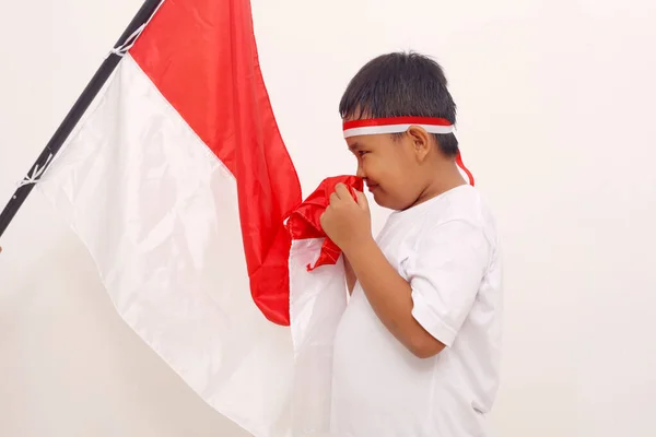 Asian Boy Standing While Kissing Indonesian Flag Salute Gesture Independence — Stock Fotó