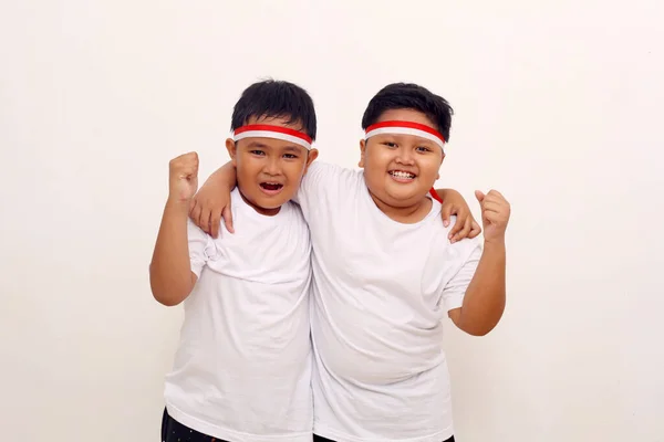 Two Asian Boys Embrace Each Other Clenched Hand Indonesian Independence — Zdjęcie stockowe