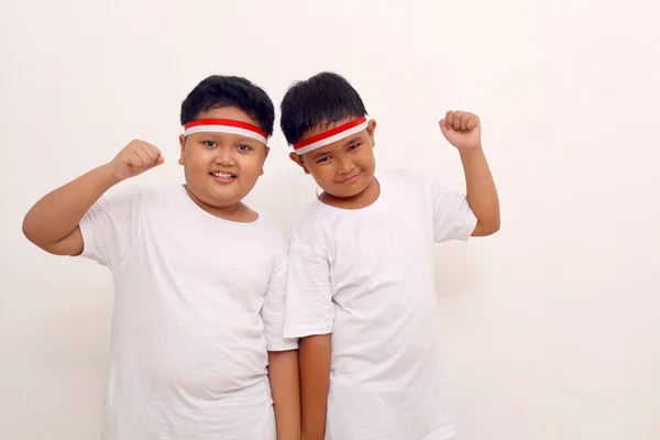 Two Asian Boys Standing Clenched Hand Indonesian Independence Day Concept — Stok Foto