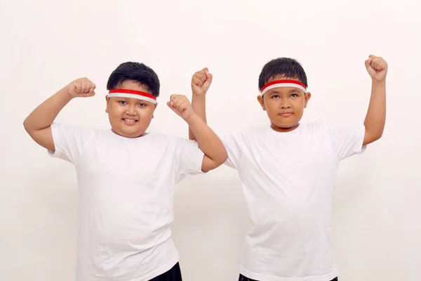 Adorable Asian Boys Standing While Clenching Hands Indonesian Independence Day — Zdjęcie stockowe