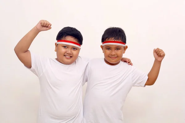 Adorable Asian Boys Standing While Clenching Hands Indonesian Independence Day — Zdjęcie stockowe