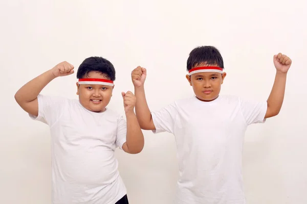 Adorable Asian Boys Standing While Clenching Hands Indonesian Independence Day — Zdjęcie stockowe