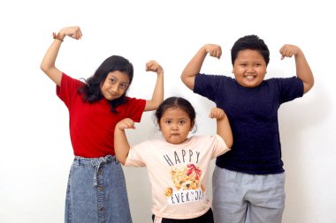 Group of asian kids with happy expression and showing strong gesture. Isolated on white background