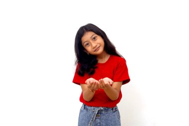 Wow and amazed expression of asian little girl while holding something on her hands.