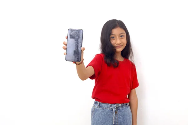 Happy Asian Little Girl Standing While Showing Blank Cell Phone — Stockfoto