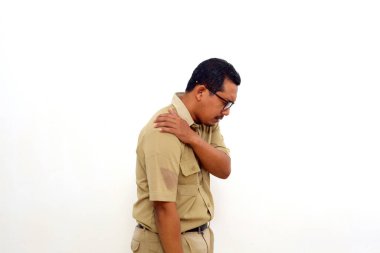 Tired Indonesian government employees suffering from shoulder pain. Isolated on white background