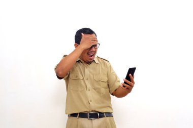 Wow and amazed expression of Indonesian government employees while getting good news from his phone