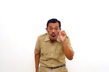 Wow and amazed Indonesian government employees standing with unbelievable expression. Isolated on white