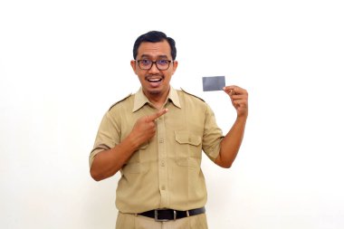 Happy Indonesian government employees standing while holding blank card. Isolated on white background