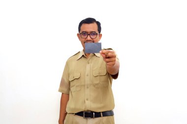 Happy Indonesian government employees standing while holding blank card. Isolated on white background