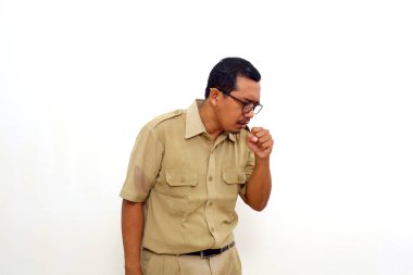 Indonesian government employees coughing into his fist. Isolated on white background