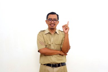 Happy Indonesian government employees standing while getting an idea and pointing up his finger