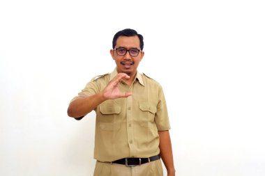 Indonesian government employees standing while gesturing letter C. Isolated on white background