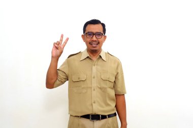 Indonesian government employees showing two fingers or victory gesture. Isolated on white