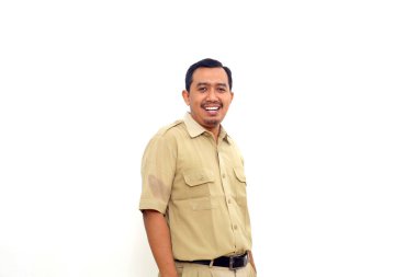 Indonesian government employees standing while smiling and looking at the camera. Isolated on white