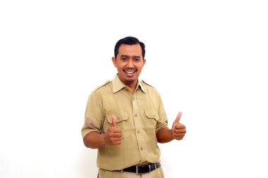 Happy Indonesian government employees standing while showing thumbs up. Isolated on white background