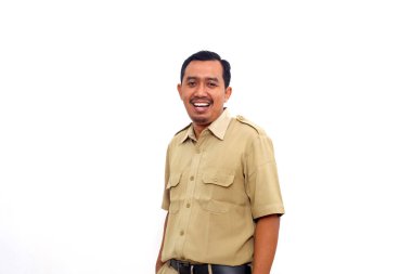Indonesian government employees standing while smiling and looking at the camera. Isolated on white