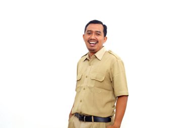 Indonesian government employees standing while smiling and looking at the camera. Isolated on white