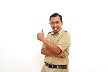 Happy Indonesian government employees standing while showing thumbs up. Isolated on white background