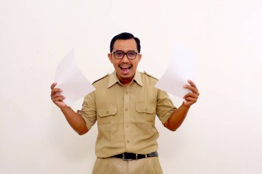 Happy Indonesian government employees standing while holding a document or paper. Isolated on white