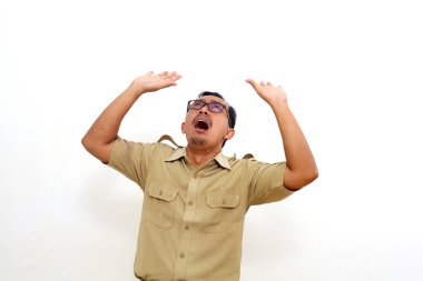 Wow and surprised expression of Indonesian government employees standing while looking above